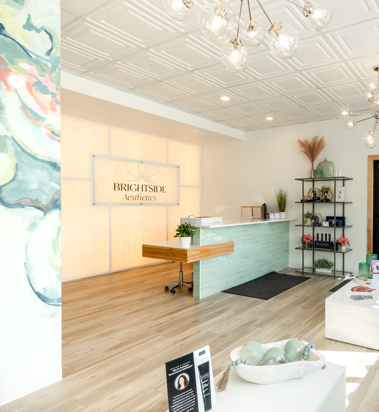 The view of the Brightside Aesthetics front office as a woman walks in treatment for Emface in Des Moines.