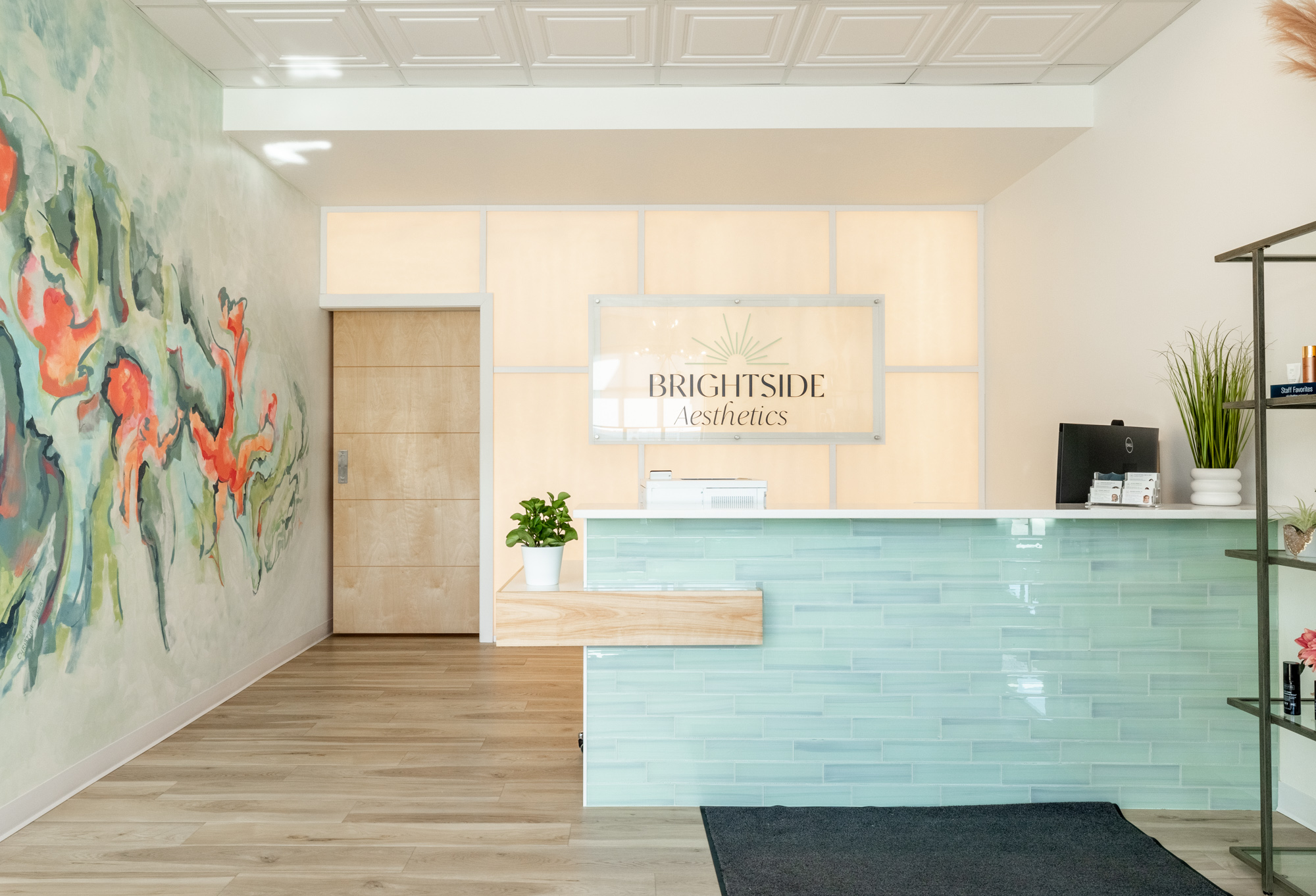 The view of the Brightside Aesthetics front office as a woman walks in treatment for Emface in Des Moines.