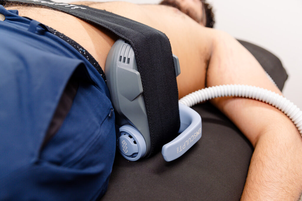 Close up of a male patient undergoing Emsculpt NEO near West Des Moines on his abdomen.